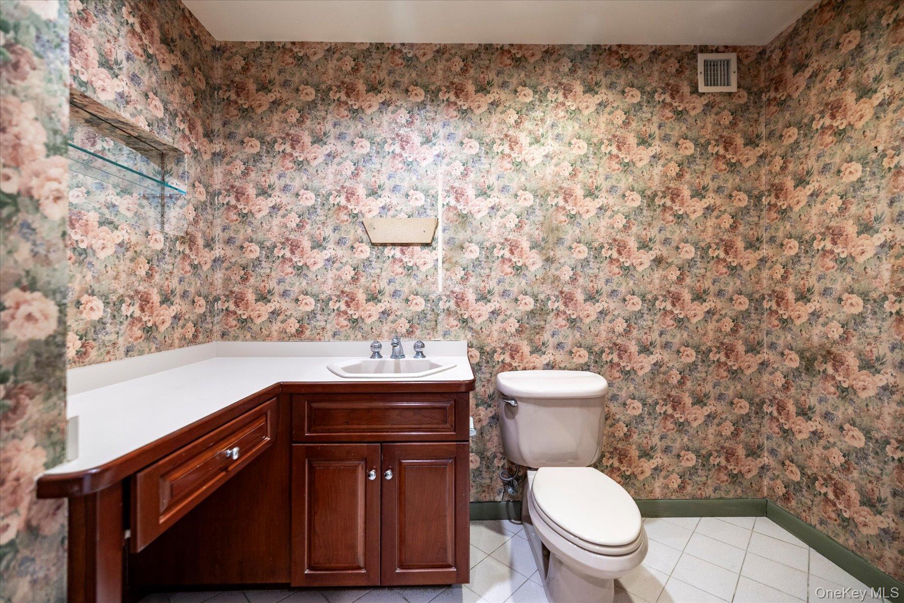 360 Shore Road, Unit 6L & 6M Long Beach, NY 11561 - Photo 14 of 28 a bathroom with a toilet and a sink