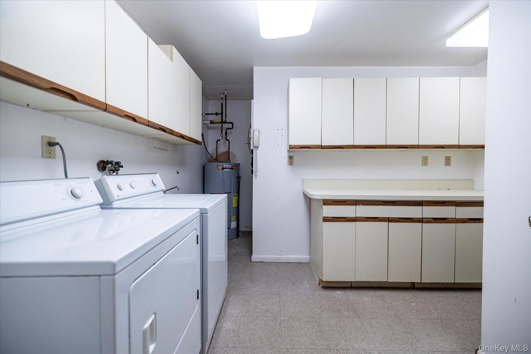 360 Shore Road, Unit 6L & 6M Long Beach, NY 11561 - Photo 15 of 28 a utility room with dryer and washer