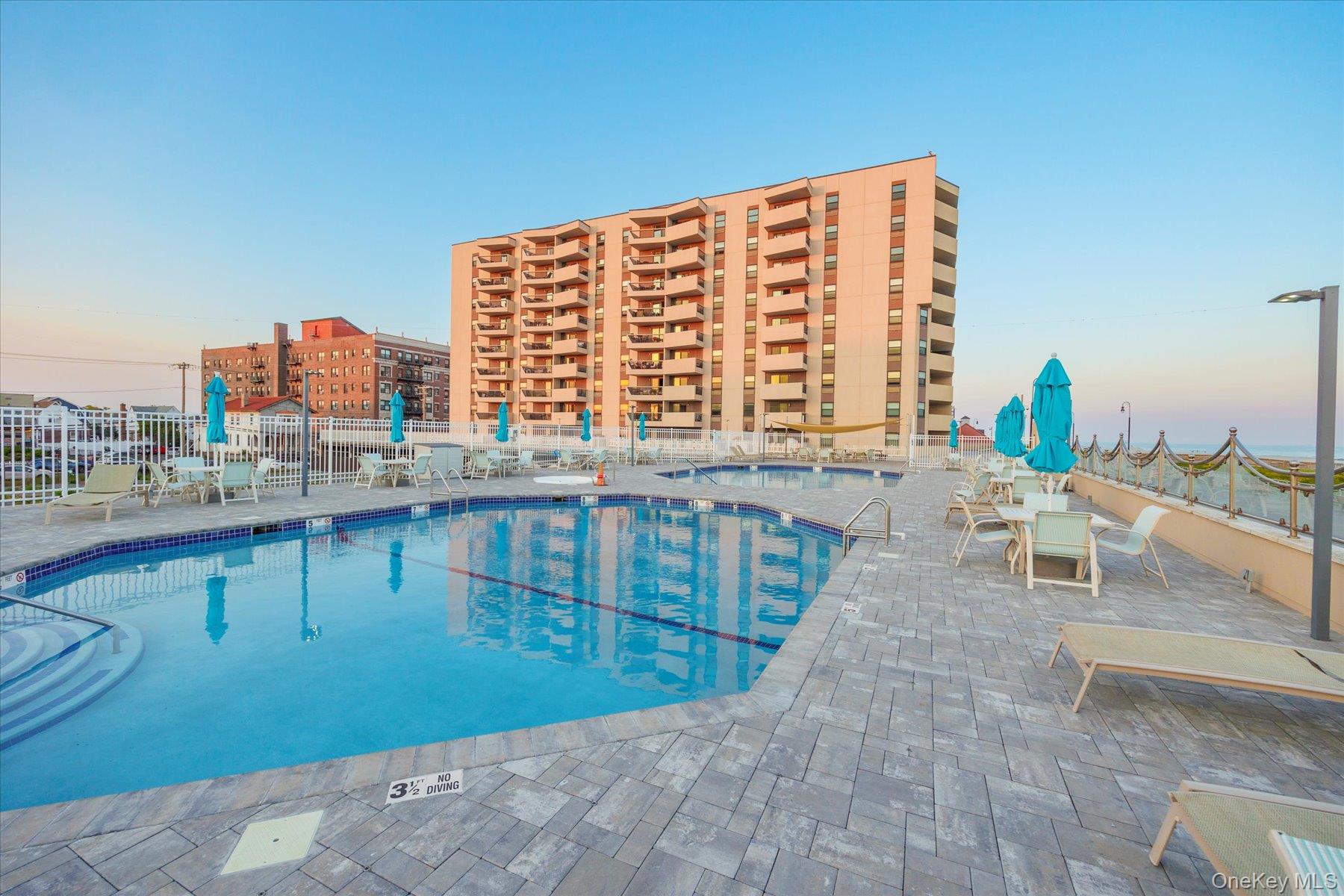 360 Shore Road, Unit 6L & 6M Long Beach, NY 11561 - Photo 24 of 28 a view of a balcony with outdoor seating