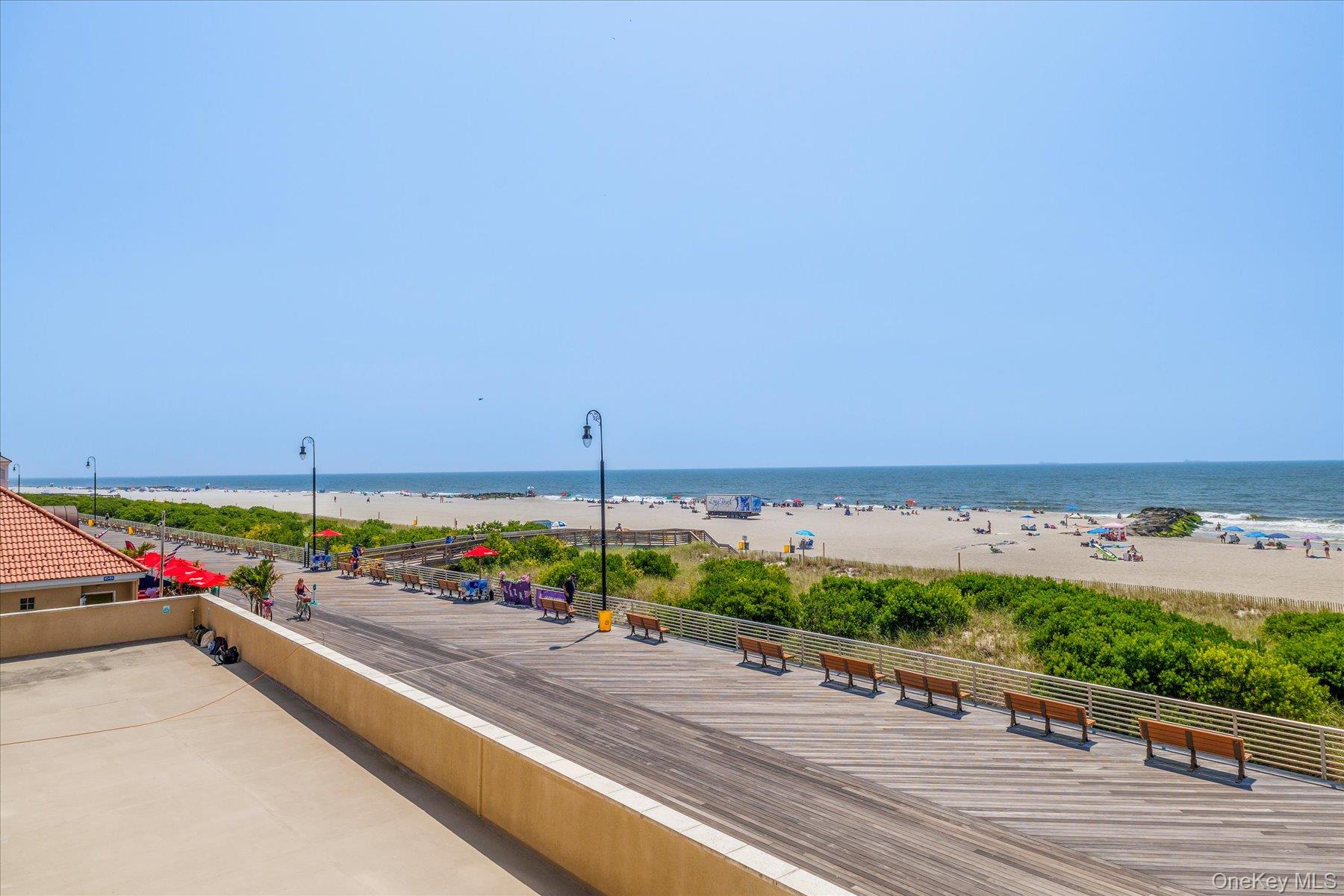360 Shore Road, Unit 6L & 6M Long Beach, NY 11561 - Photo 25 of 28 an outdoor space with furniture and mountain view in back