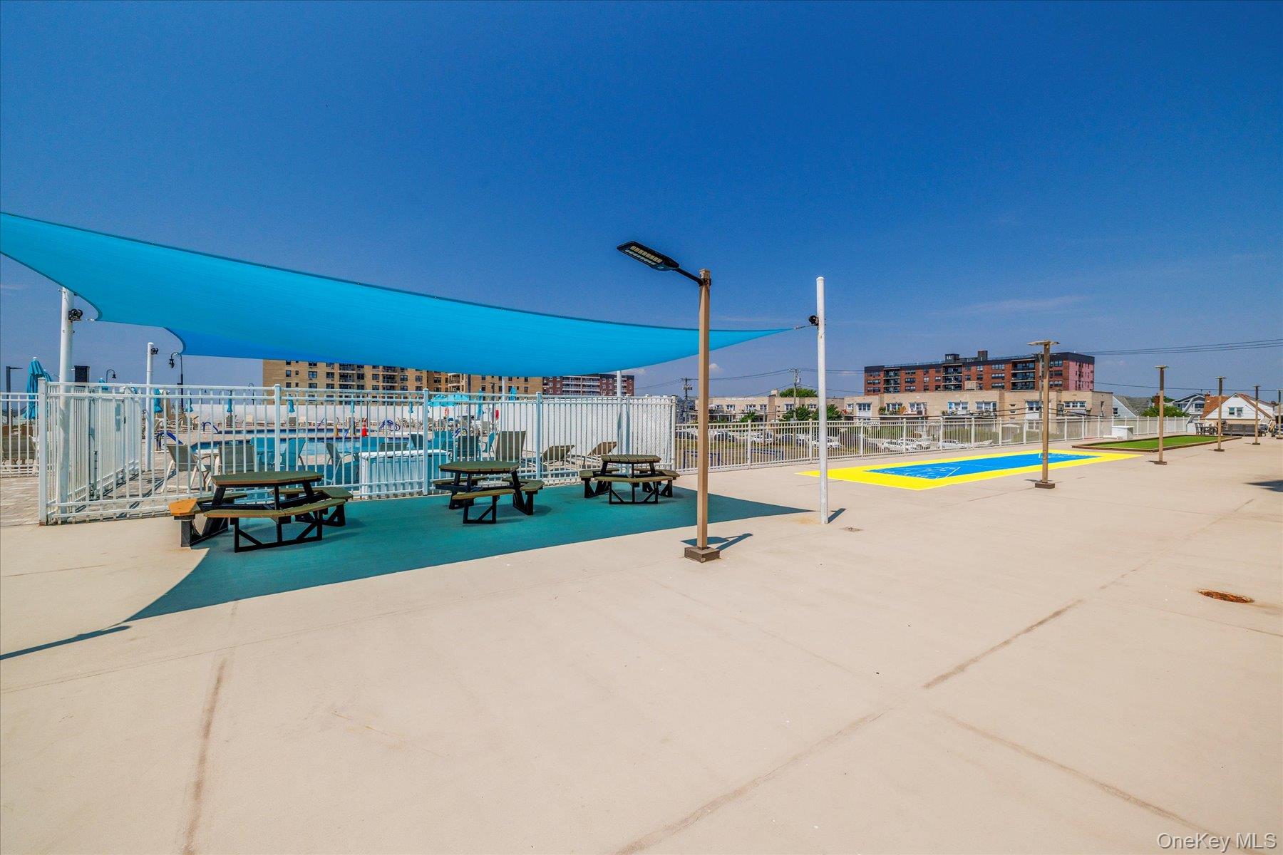 360 Shore Road, Unit 6L & 6M Long Beach, NY 11561 - Photo 26 of 28 a view of swimming pool with a patio