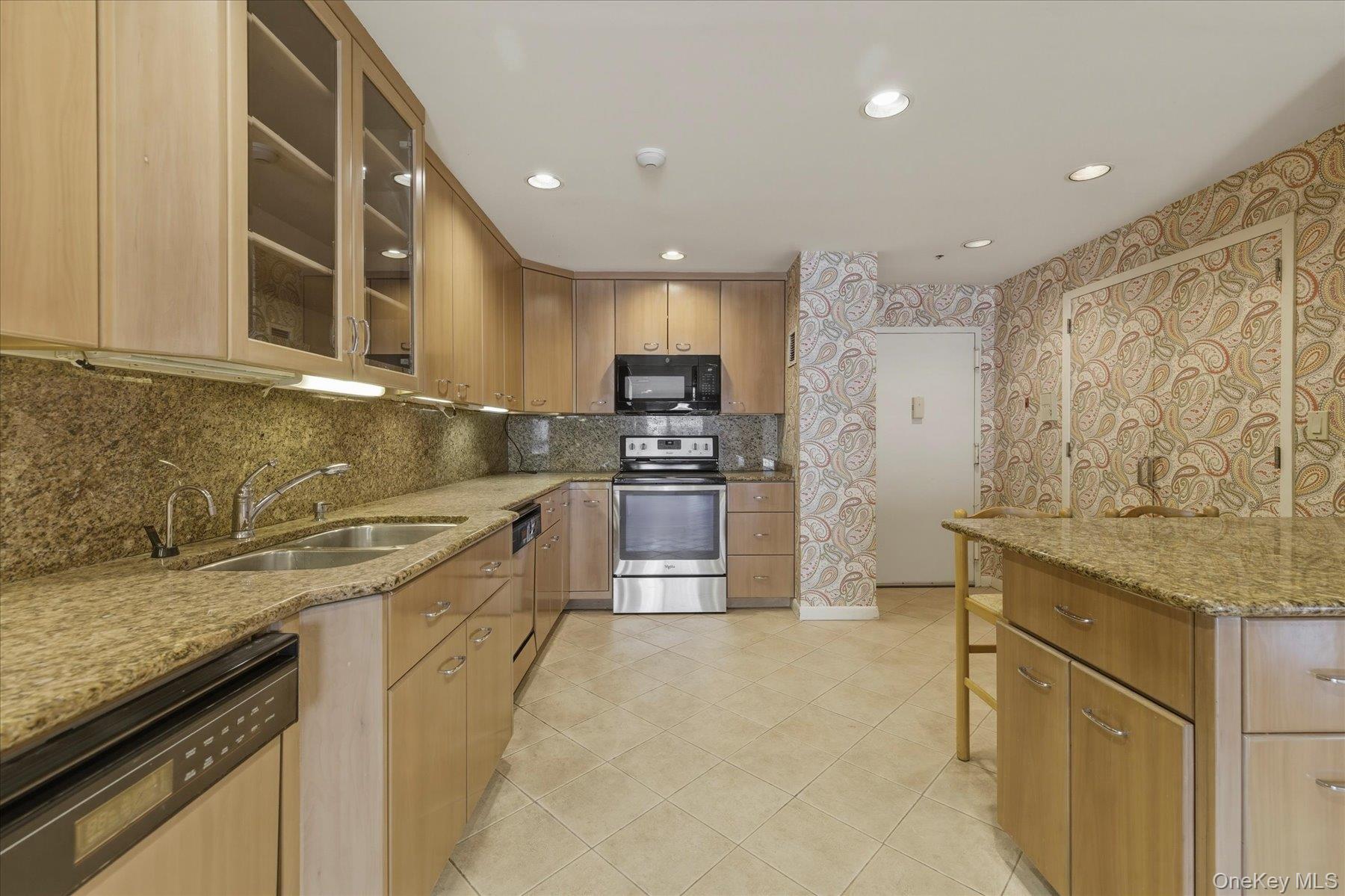 360 Shore Road, Unit 6L & 6M Long Beach, NY 11561 - Photo 5 of 28 a large kitchen with stainless steel appliances granite countertop a stove a sink and a microwave