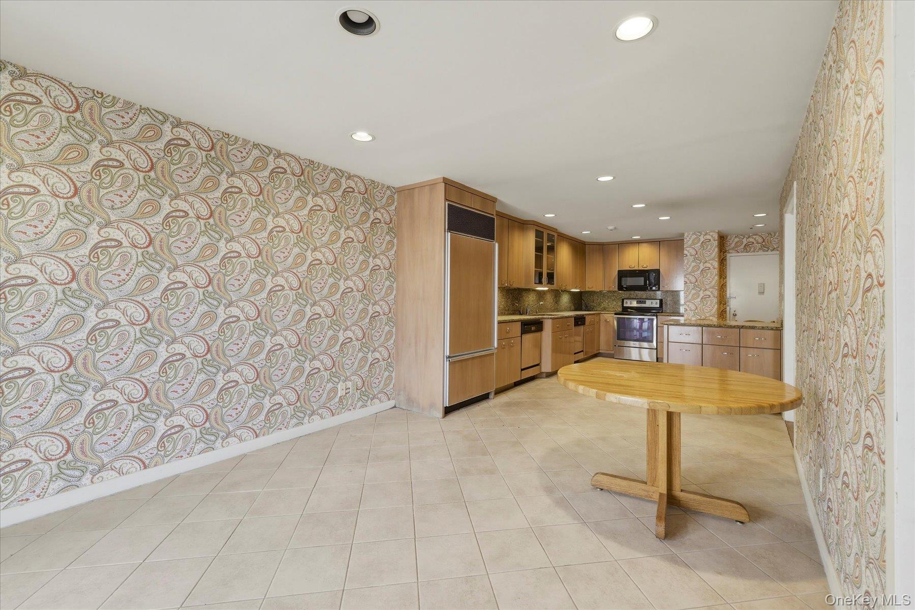 360 Shore Road, Unit 6L & 6M Long Beach, NY 11561 - Photo 6 of 28 a view of kitchen with furniture and refrigerator
