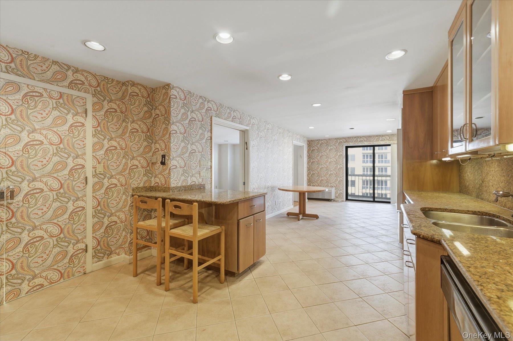 360 Shore Road, Unit 6L & 6M Long Beach, NY 11561 - Photo 7 of 28 a view of a kitchen with furniture and a ceiling fan