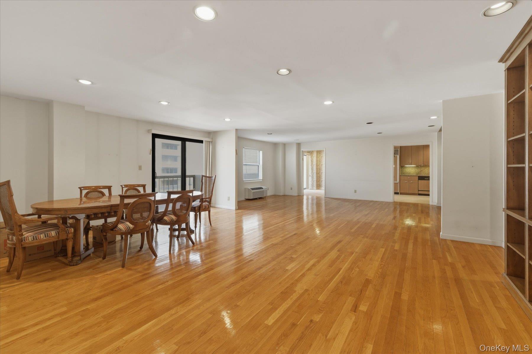 360 Shore Road, Unit 6L & 6M Long Beach, NY 11561 - Photo 10 of 28 a view of a dining room with furniture and wooden floor