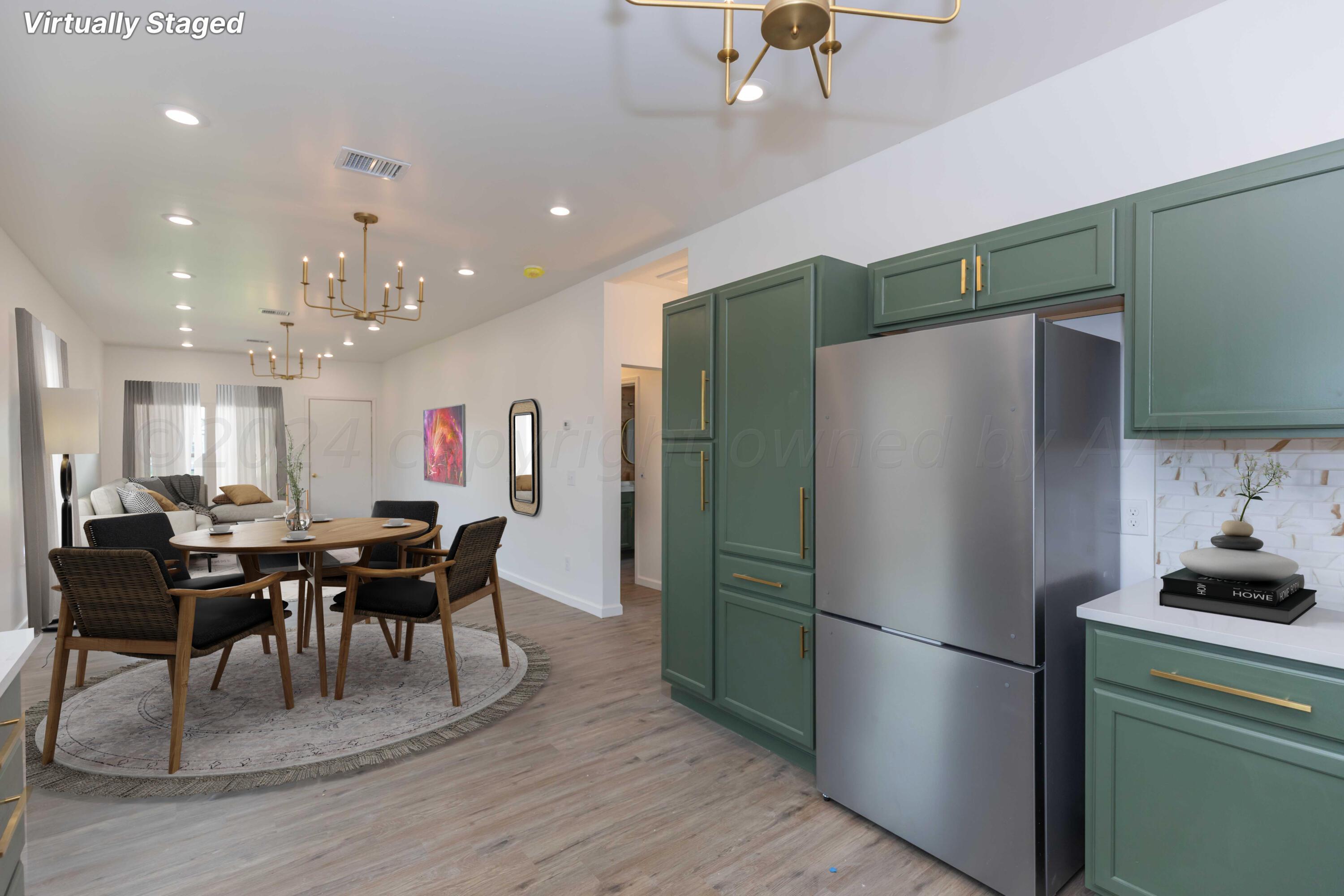 4010 Bowie Street Amarillo, TX 79110 - Photo 7 of 33 a kitchen with a refrigerator a dining table and chairs