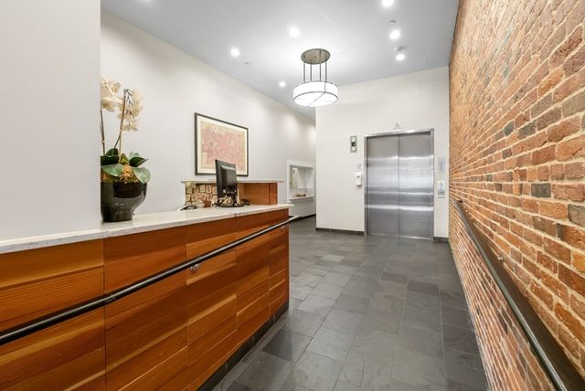 a city street lined with buildings and cars