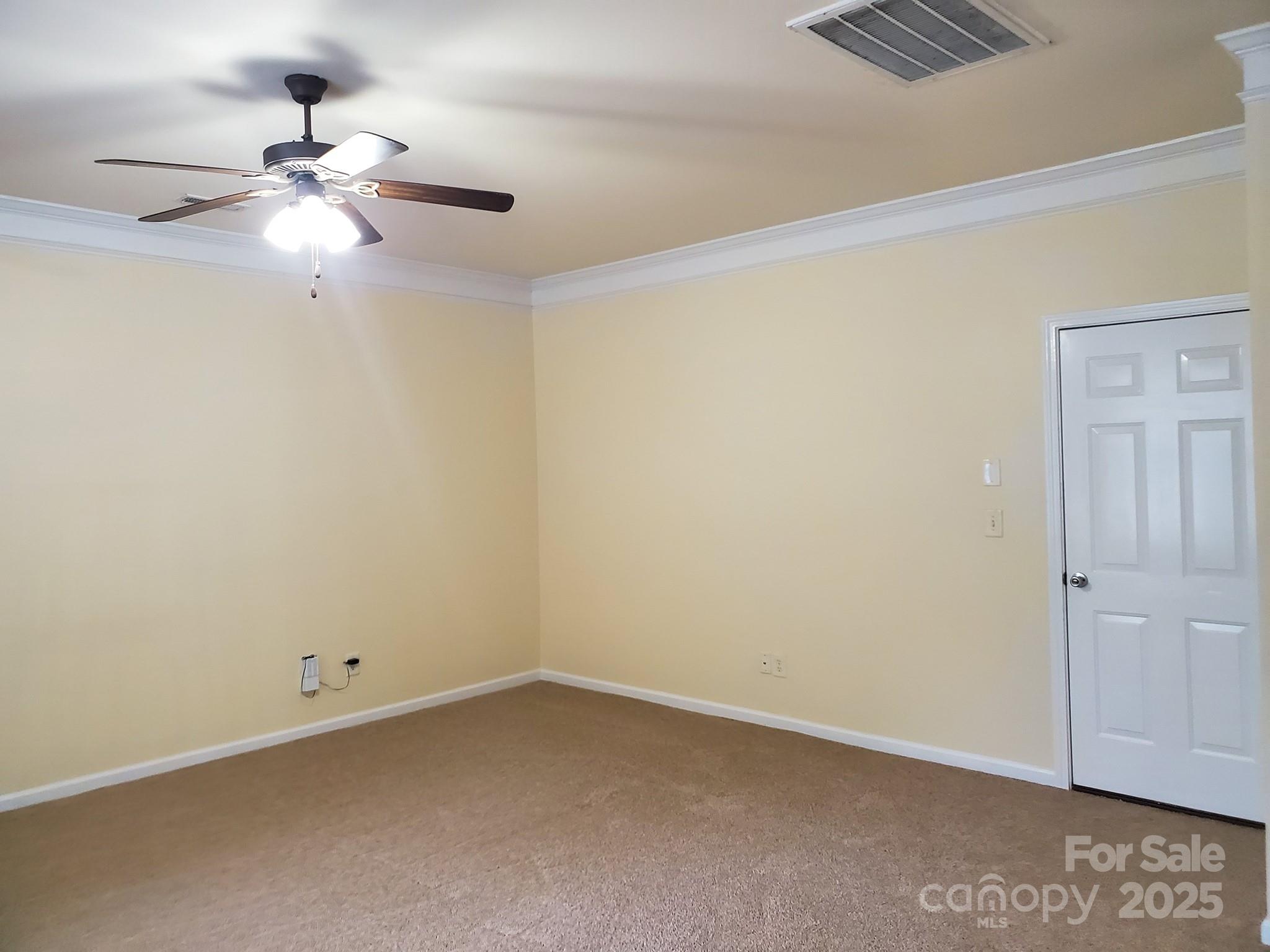13008 Rothe House Road Charlotte, NC 28273 - Photo 16 of 23 an empty room with a ceiling fan and a window