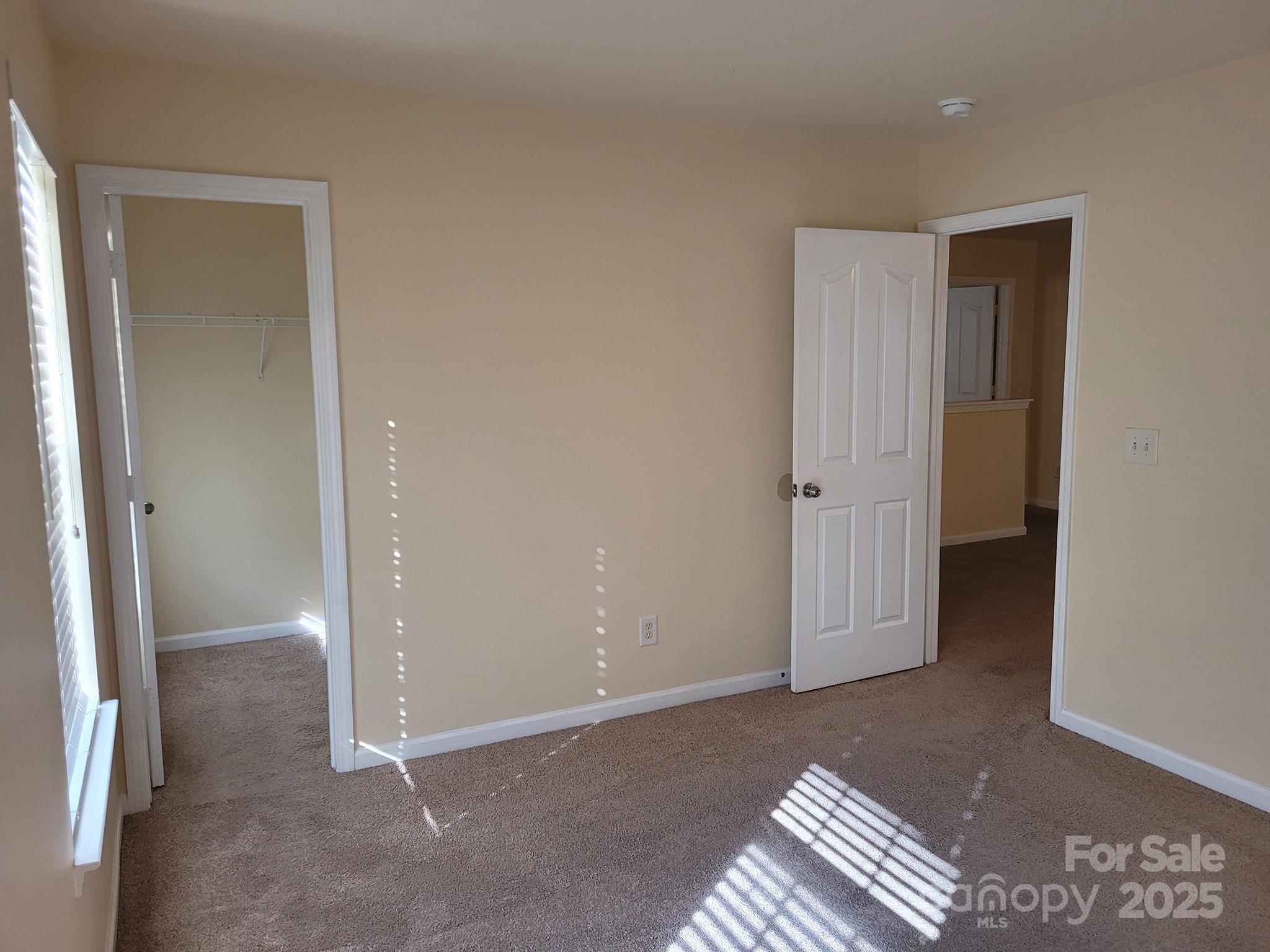 13008 Rothe House Road Charlotte, NC 28273 - Photo 22 of 23 an empty room with windows