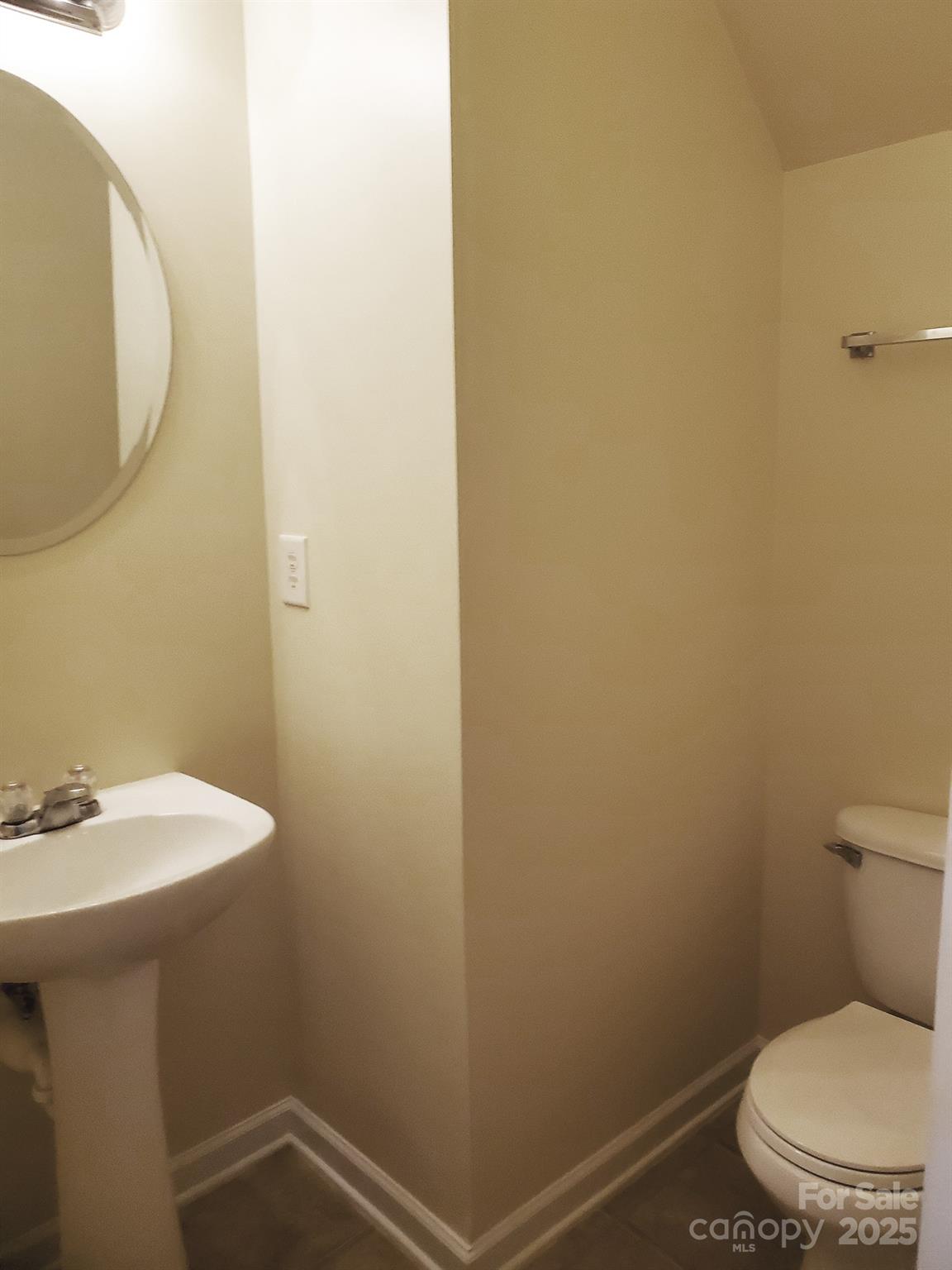 13008 Rothe House Road Charlotte, NC 28273 - Photo 10 of 23 a bathroom with a sink a toilet and a mirror