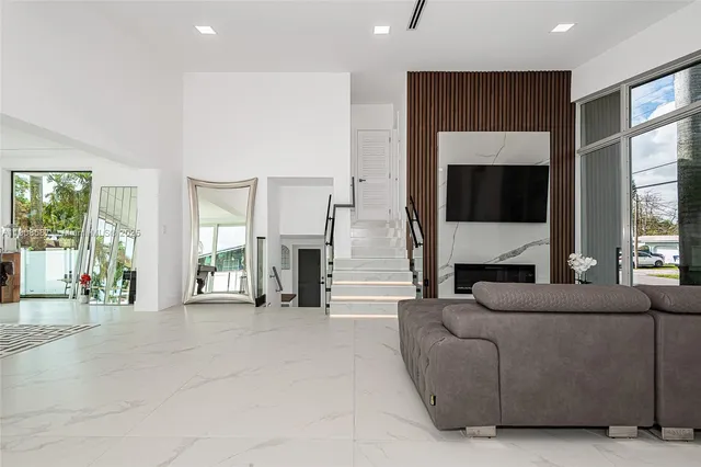 a view of kitchen with furniture and refrigerator