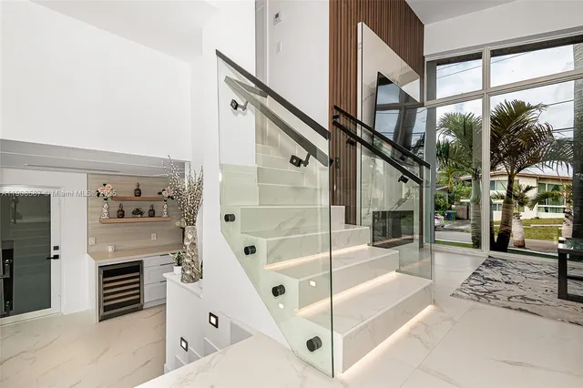 a living room with stainless steel appliances kitchen island granite countertop furniture and a kitchen view