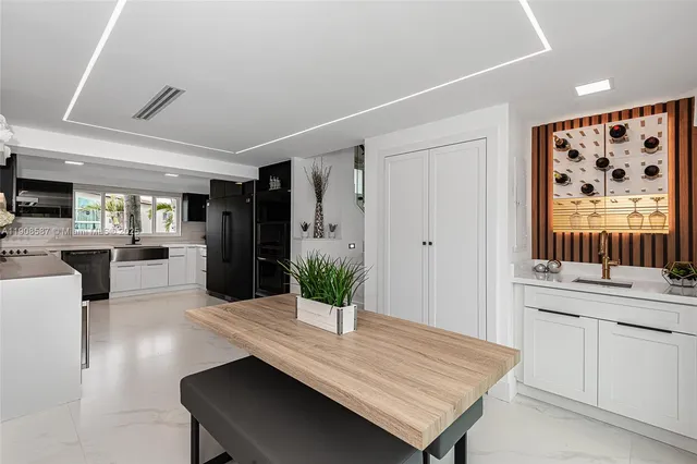 a bedroom with furniture and a large window