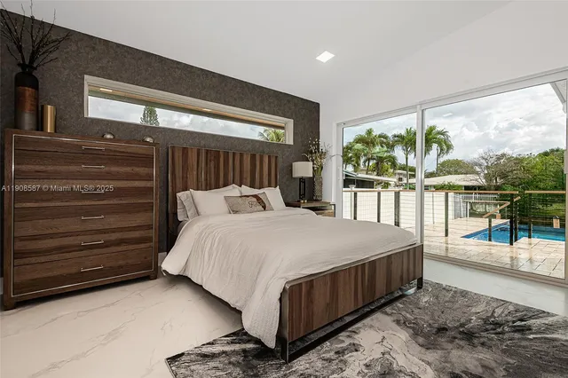 a bedroom with furniture and wooden floor