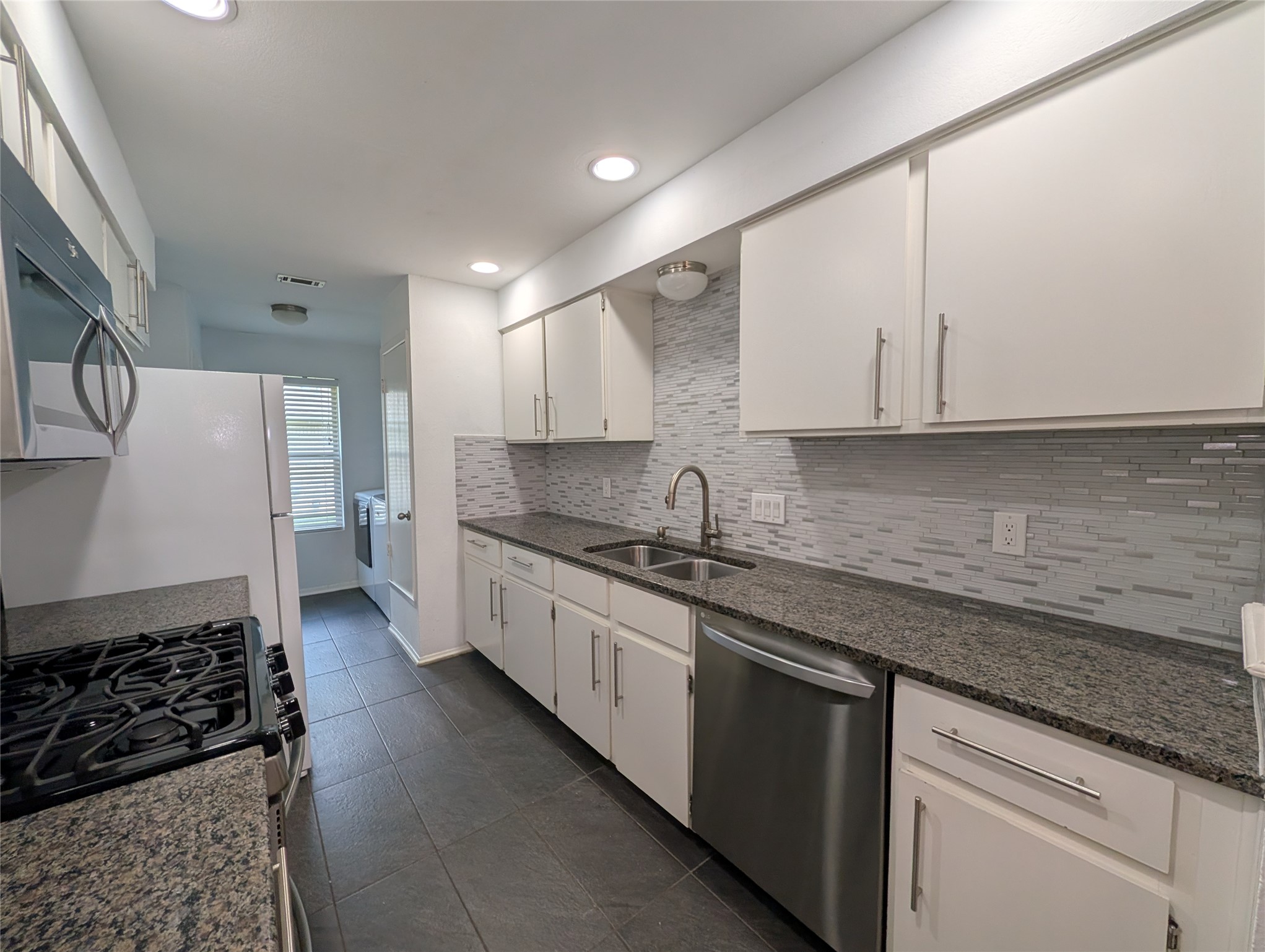 4601 Tamarack Trail Austin, TX 78727 - Photo 11 of 19 An inviting culinary space with practical counter depth and ample cabinetry awaits.