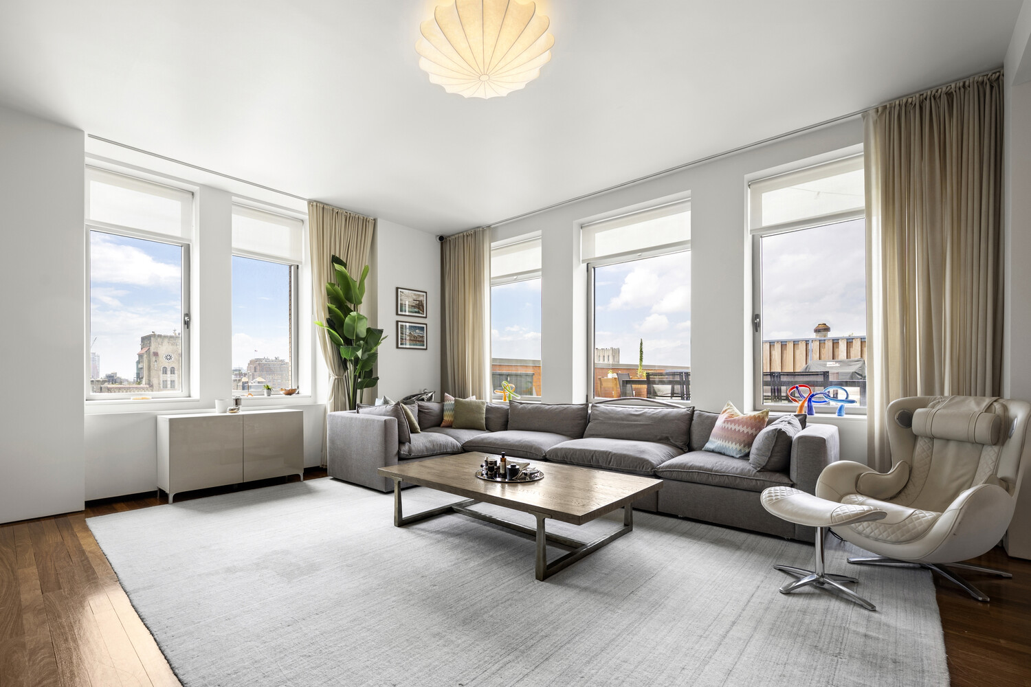 252 7th Avenue, Unit 15N Manhattan, NY 10001 - Photo 3 of 15 a living room with furniture and a large window