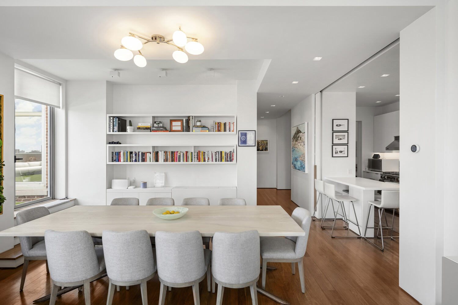 252 7th Avenue, Unit 15N Manhattan, NY 10001 - Photo 4 of 15 a view of a dining room with furniture and wooden floor