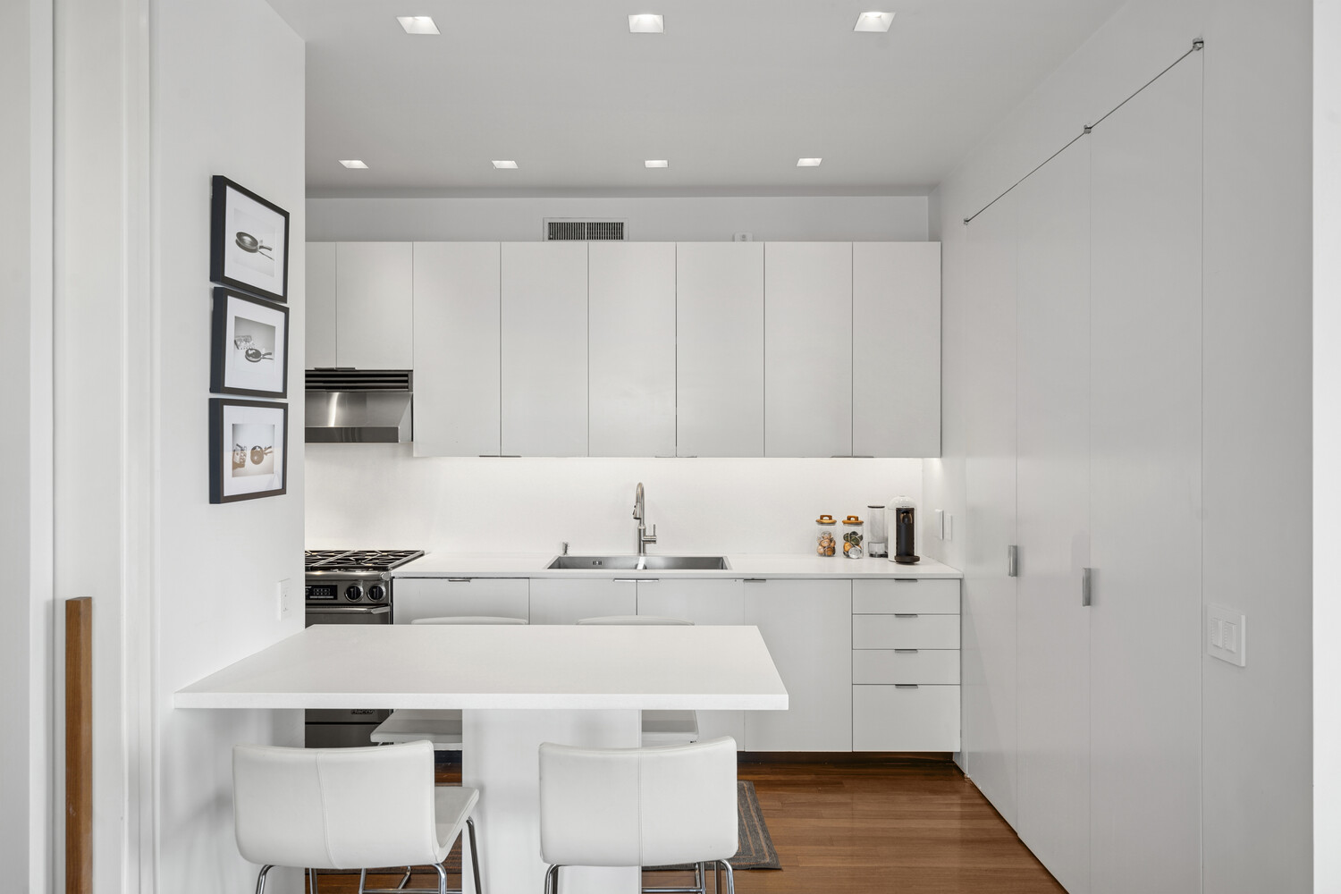 252 7th Avenue, Unit 15N Manhattan, NY 10001 - Photo 5 of 15 a kitchen with a sink and cabinets
