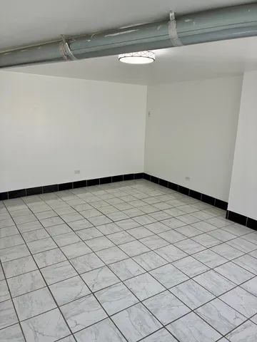 a view of a room with white walls