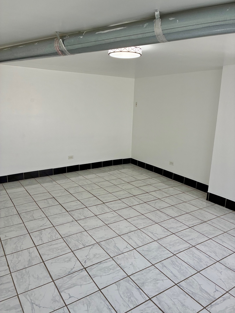 1111 North Leclaire Avenue, Unit B Chicago, IL 60651 - Photo 4 of 11 a view of a room with white walls