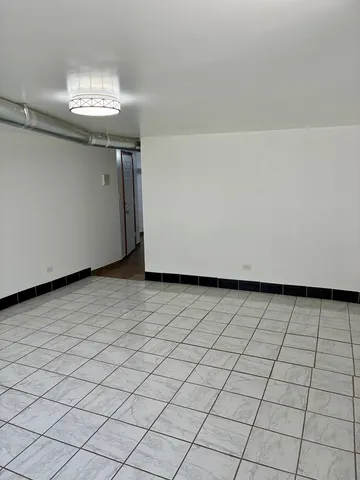 a view of a storage & utility room with a sink