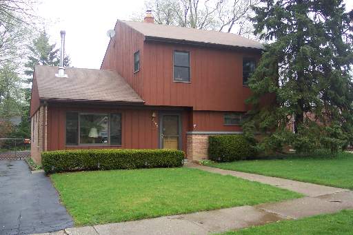 2456 Hawthorne Road Homewood, IL 60430 - Photo 1 of 1 a front view of a house with a yard