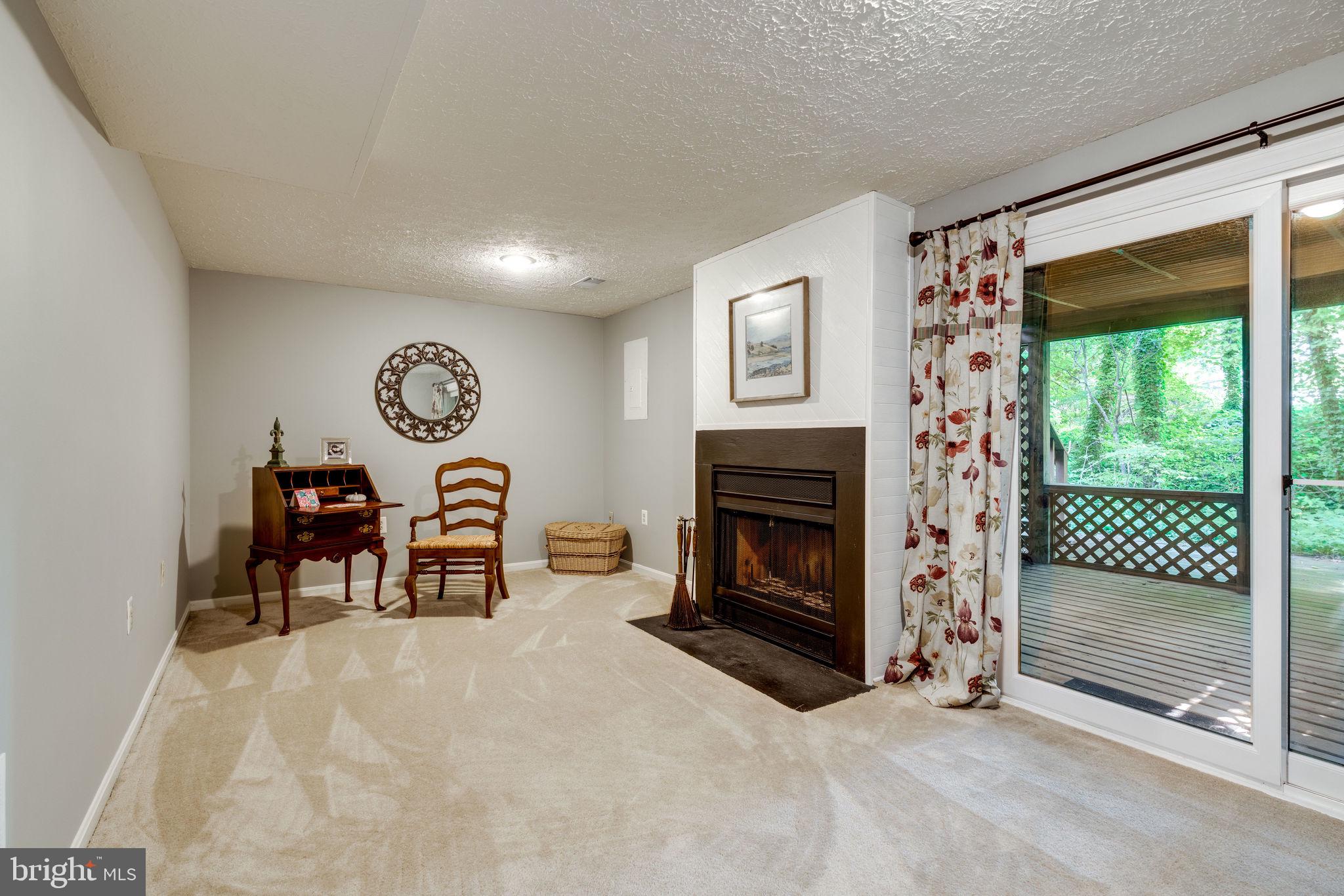 7371 Stream Way Springfield, VA 22152 - Photo 31 of 58 Lower level living room w/ fireplace