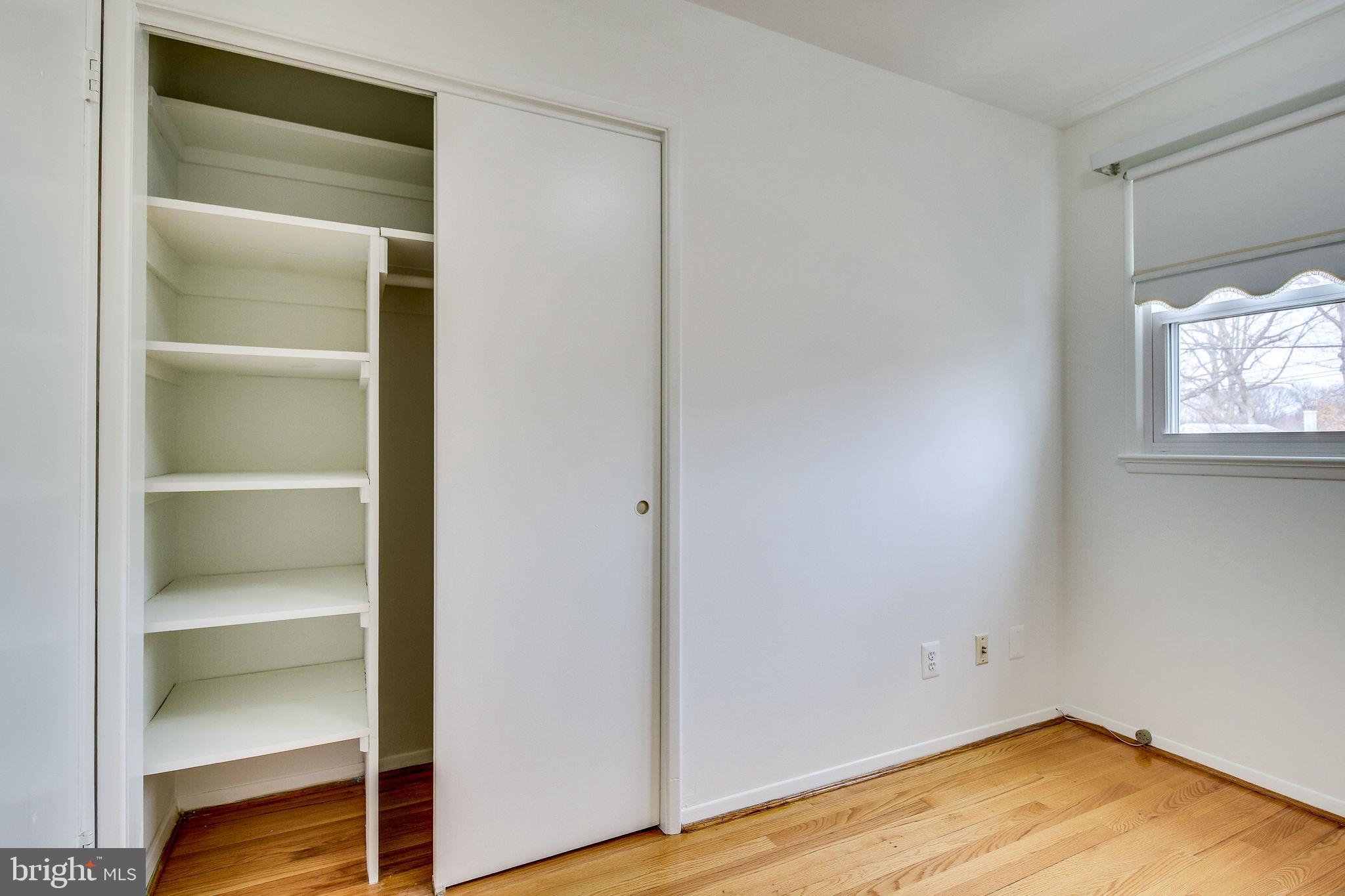 7421 Grace Street Springfield, VA 22150 - Photo 13 of 32 UPPPER BR/OFFICE BUILT IN SHELVING/HARDWOOD FLOOR