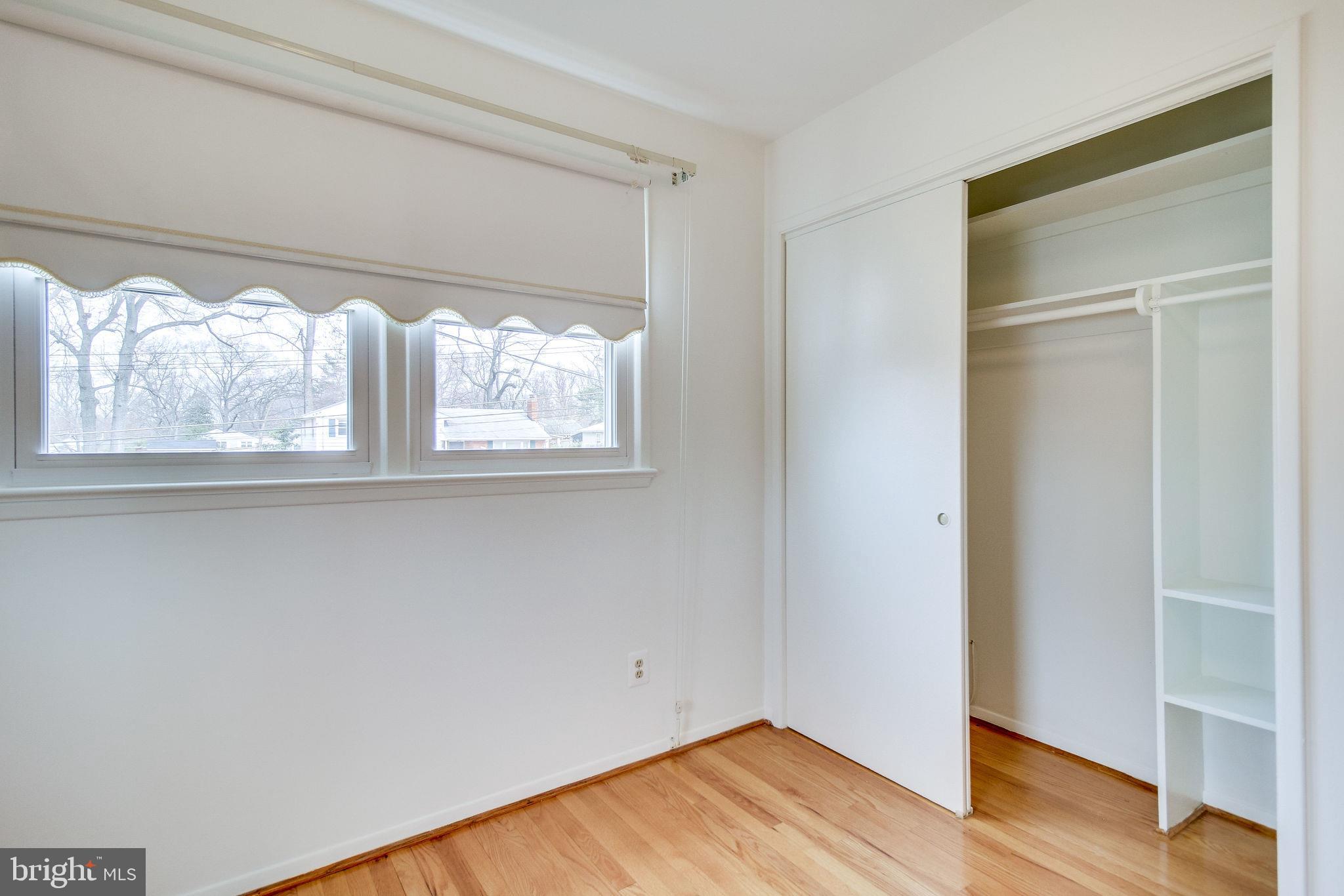 7421 Grace Street Springfield, VA 22150 - Photo 14 of 32 UPPER BEDROOM WITH BUILT-IN SHELVING/SHADES COVEY