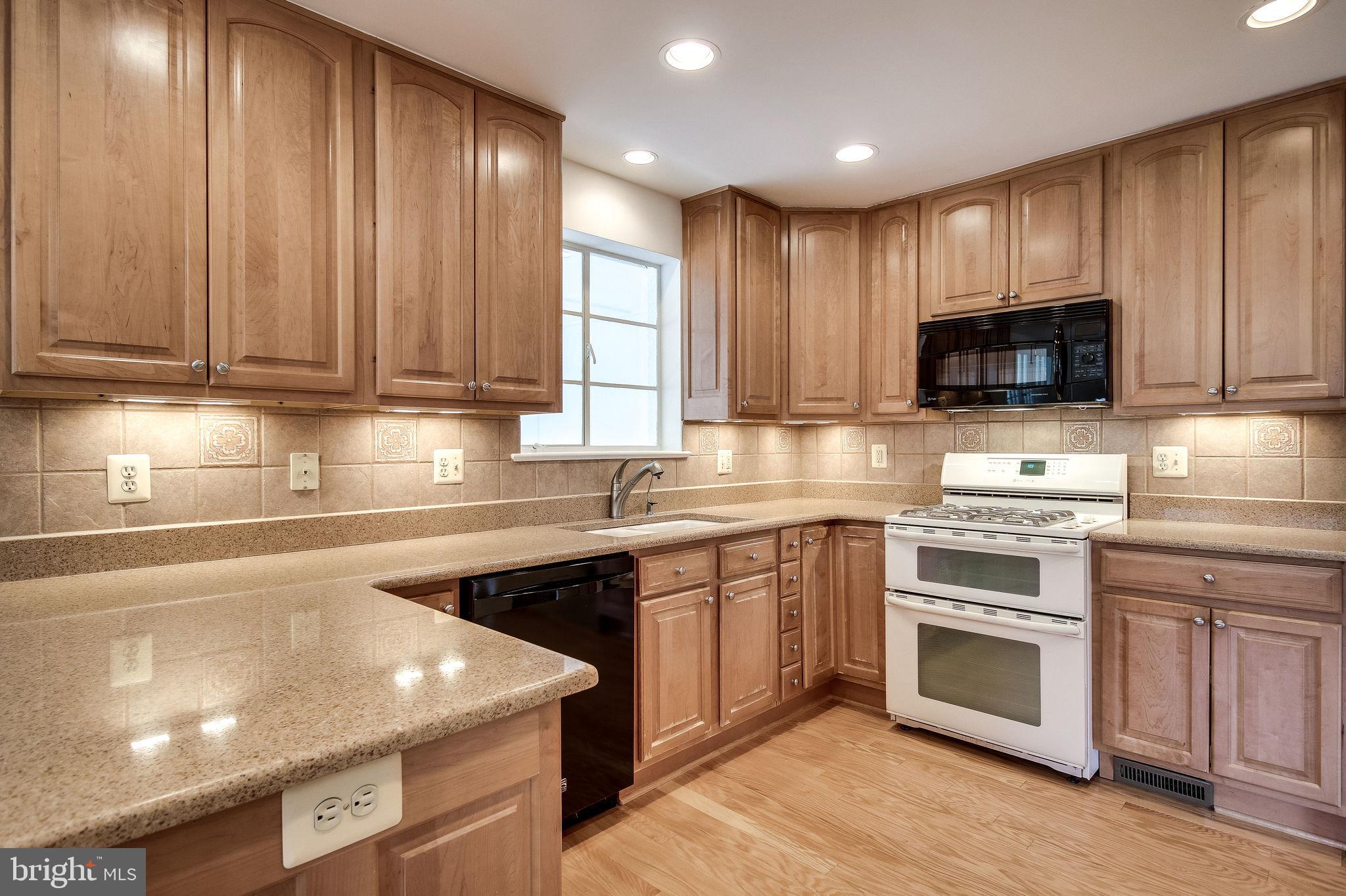 7421 Grace Street Springfield, VA 22150 - Photo 21 of 32 RENOVATED KITCHEN OPEN TO DINING ROOM