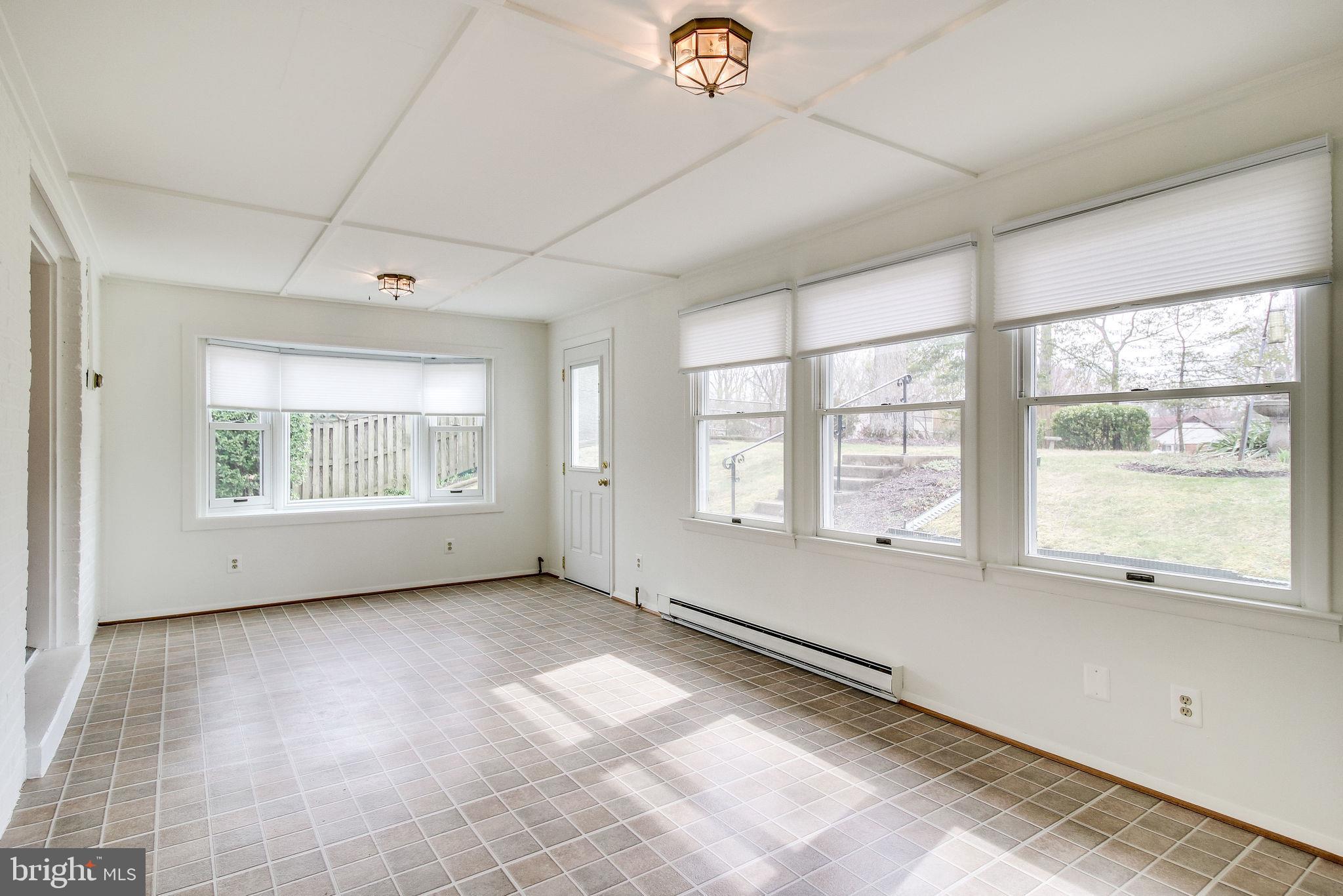 7421 Grace Street Springfield, VA 22150 - Photo 25 of 32 BAY WINDOW// VIEW OF SLATE PATIO AND BACK YARD