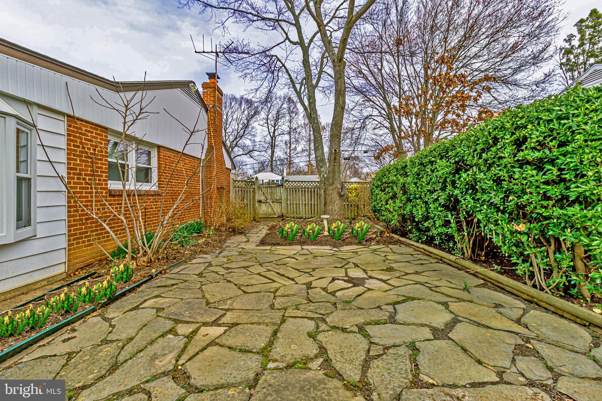 7421 Grace Street Springfield, VA 22150 - Photo 26 of 32 SLATE PATIO EASY ACCESS FROM SUNROOM