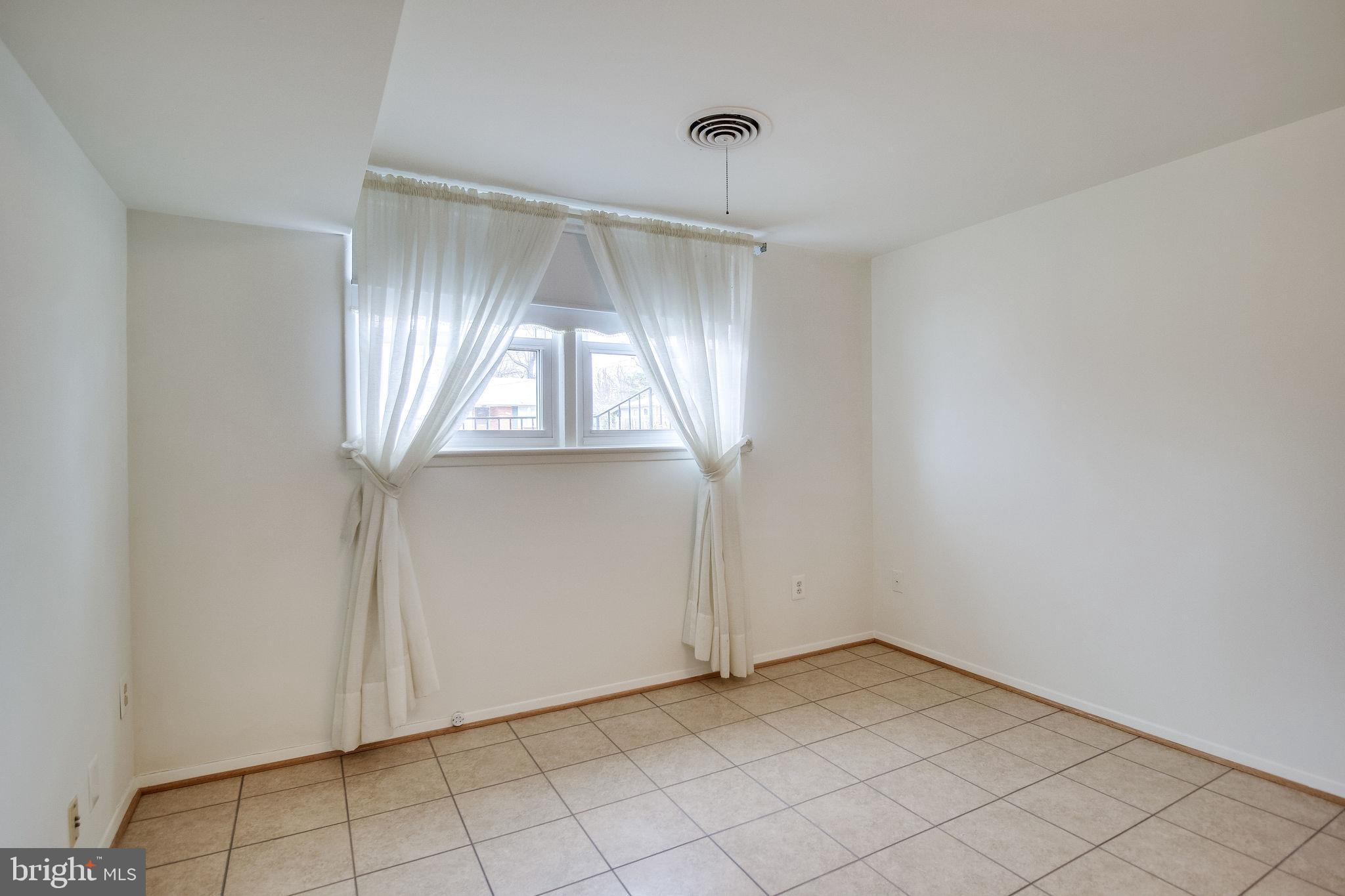 7421 Grace Street Springfield, VA 22150 - Photo 29 of 32 LIGHT FILLED DEN/REC ROOM LOWER LEVEL