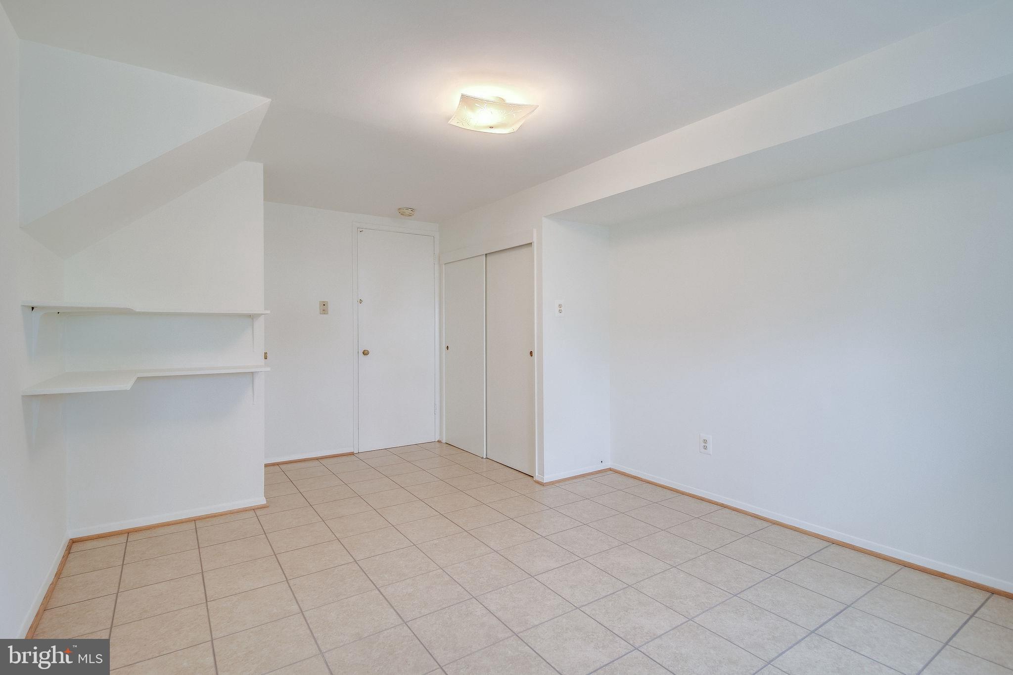 7421 Grace Street Springfield, VA 22150 - Photo 30 of 32 REC ROOM BIG CLOSET/LOTS OF SHELVING