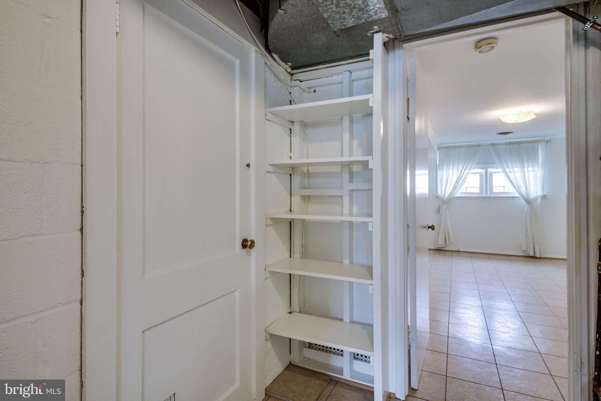 7421 Grace Street Springfield, VA 22150 - Photo 31 of 32 SHELVING/STORAGE//GARAGE ACCESS WITH EXT. DOOR
