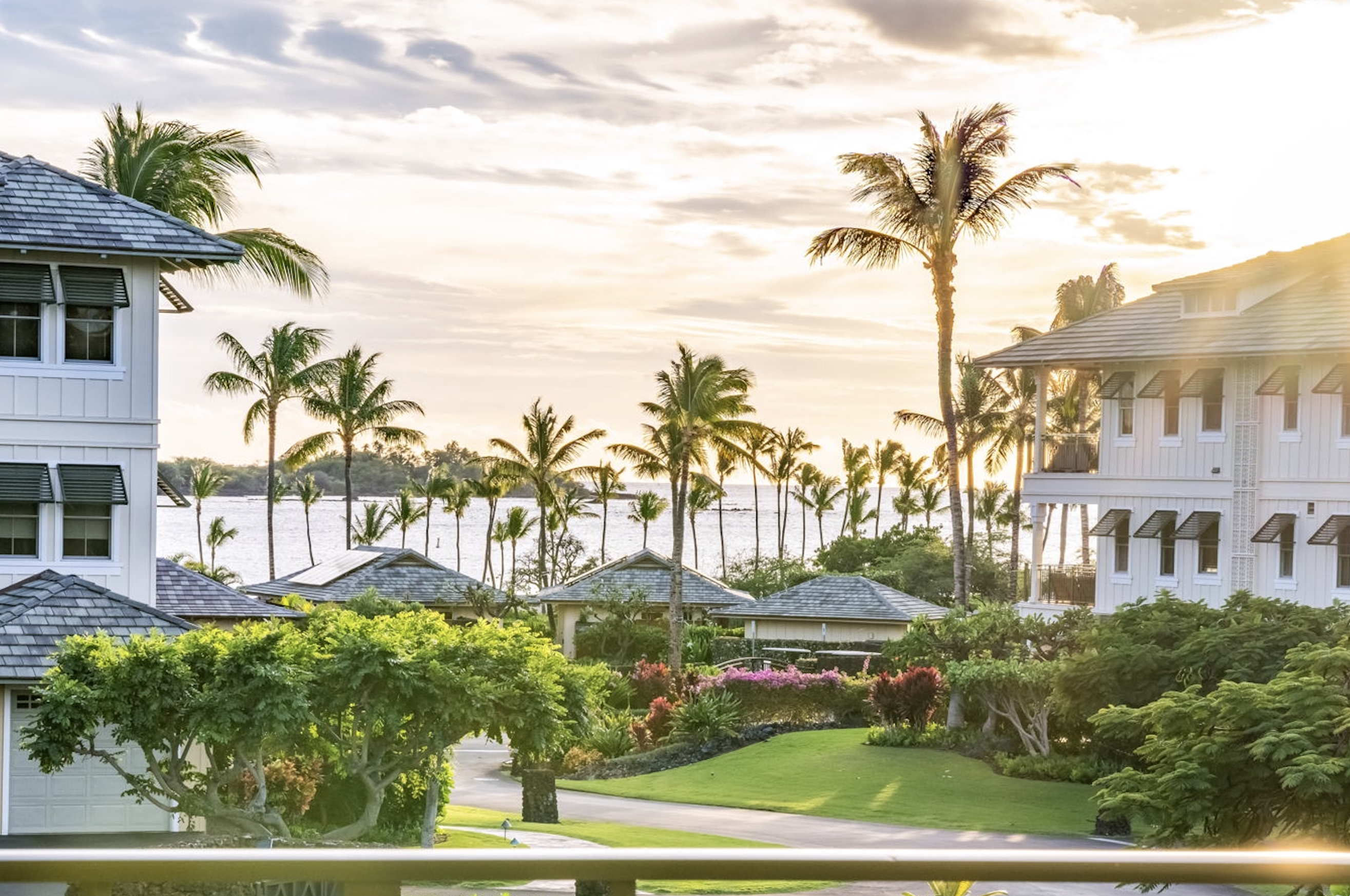 69-1000 Kolea Kai Circle, Unit 14H Waikoloa, HI 96738 - Photo 1 of 29 a front view of a house with a garden and palm trees
