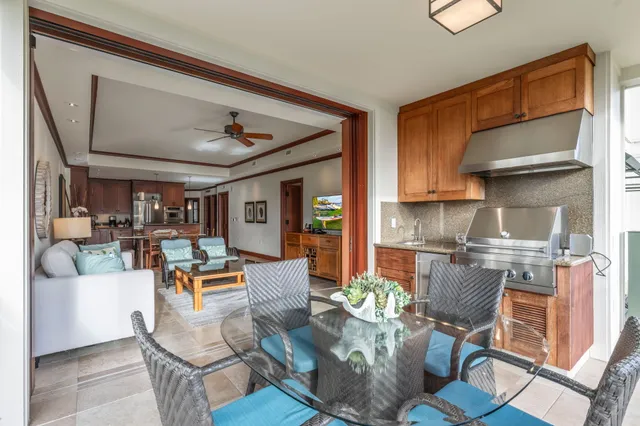 a living room with fireplace furniture and a rug