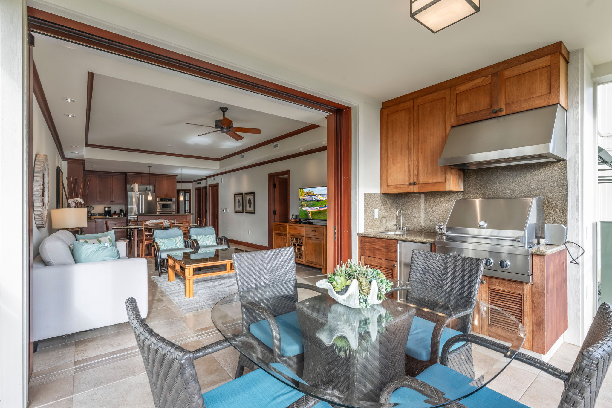 69-1000 Kolea Kai Circle, Unit 14H Waikoloa, HI 96738 - Photo 22 of 29 a living room with fireplace furniture and a rug