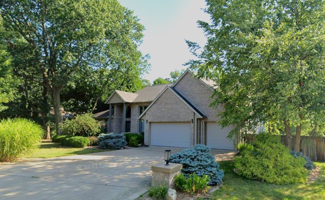 2710 8th St Court Moline, IL 61265 - Photo 1 of 1 a backyard of a house with plants and trees