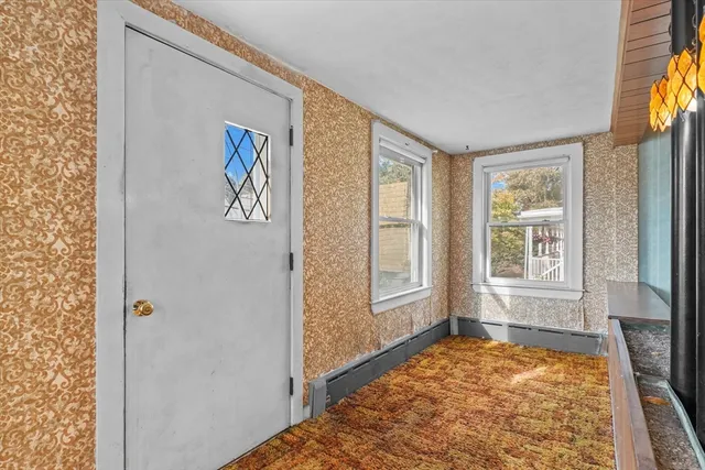 a view of an empty room and window