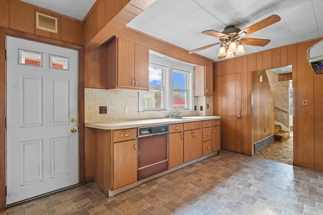 a bathroom with a sink and large window