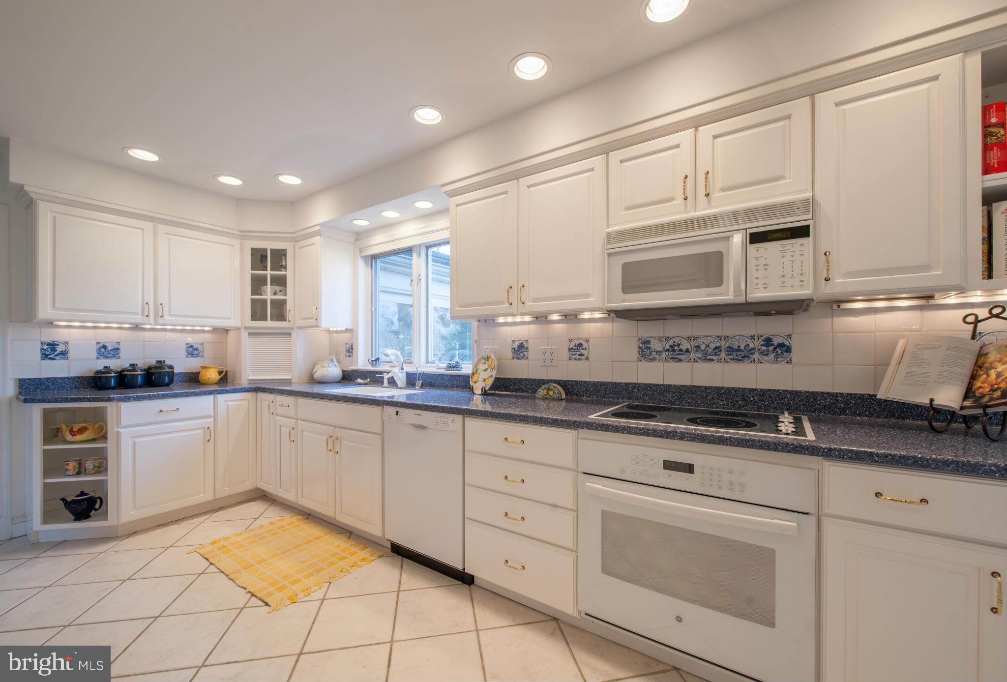 257 Providence Road Annapolis, MD 21409 - Photo 16 of 30 a kitchen with granite countertop white cabinets stainless steel appliances and a sink