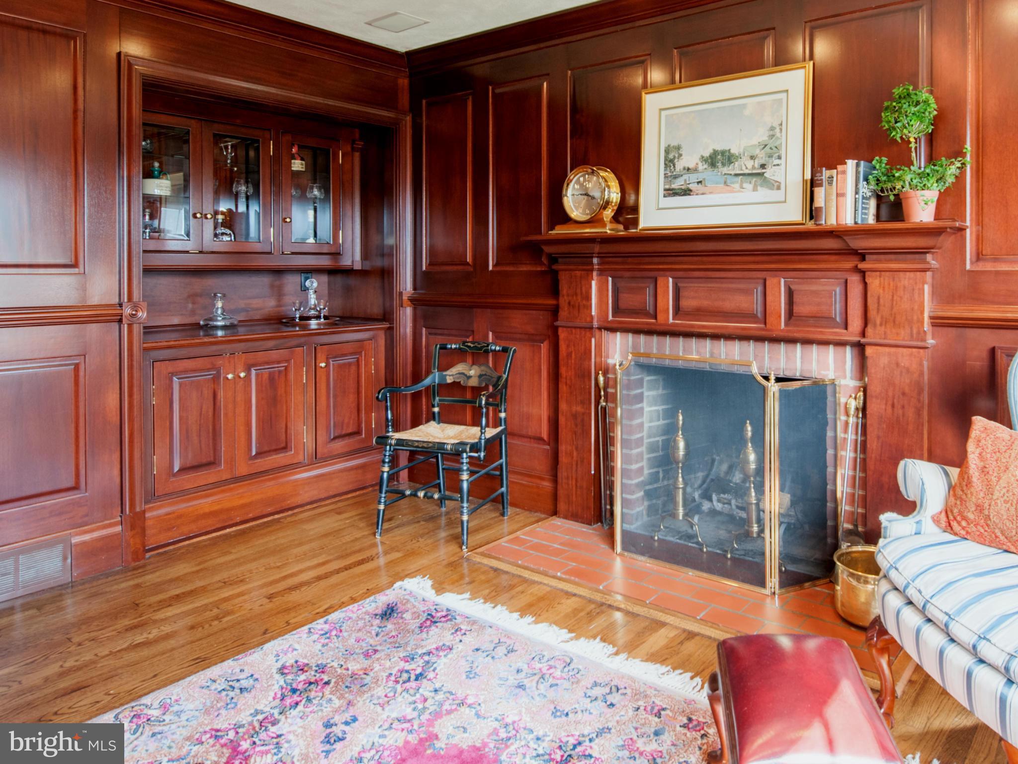 257 Providence Road Annapolis, MD 21409 - Photo 18 of 30 a living room with furniture a piano and a fireplace