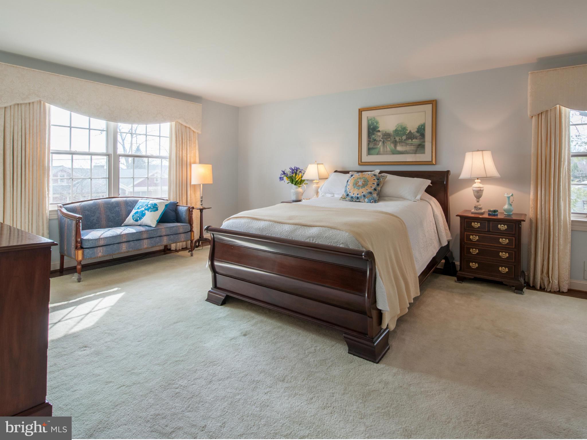 257 Providence Road Annapolis, MD 21409 - Photo 20 of 30 a spacious bedroom with a bed and a couch