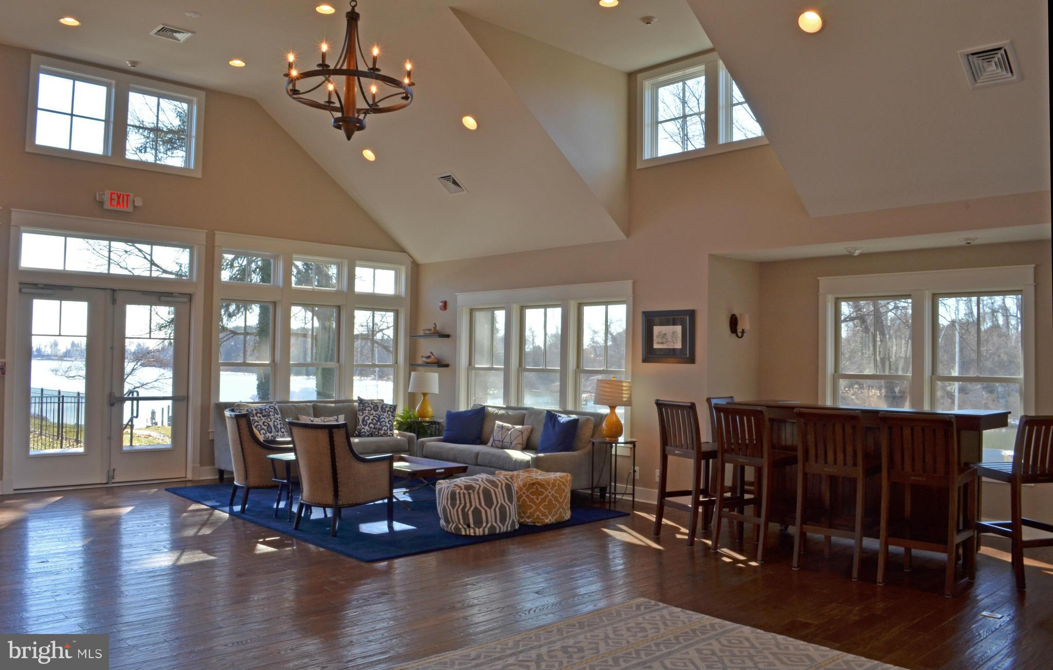 257 Providence Road Annapolis, MD 21409 - Photo 27 of 30 a living room with furniture floor to ceiling window and wooden floor