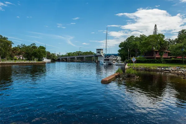 a view of a lake with houses in the back