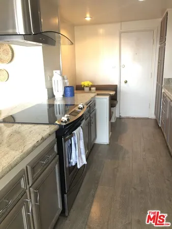 a kitchen with sink cabinets and outdoor view