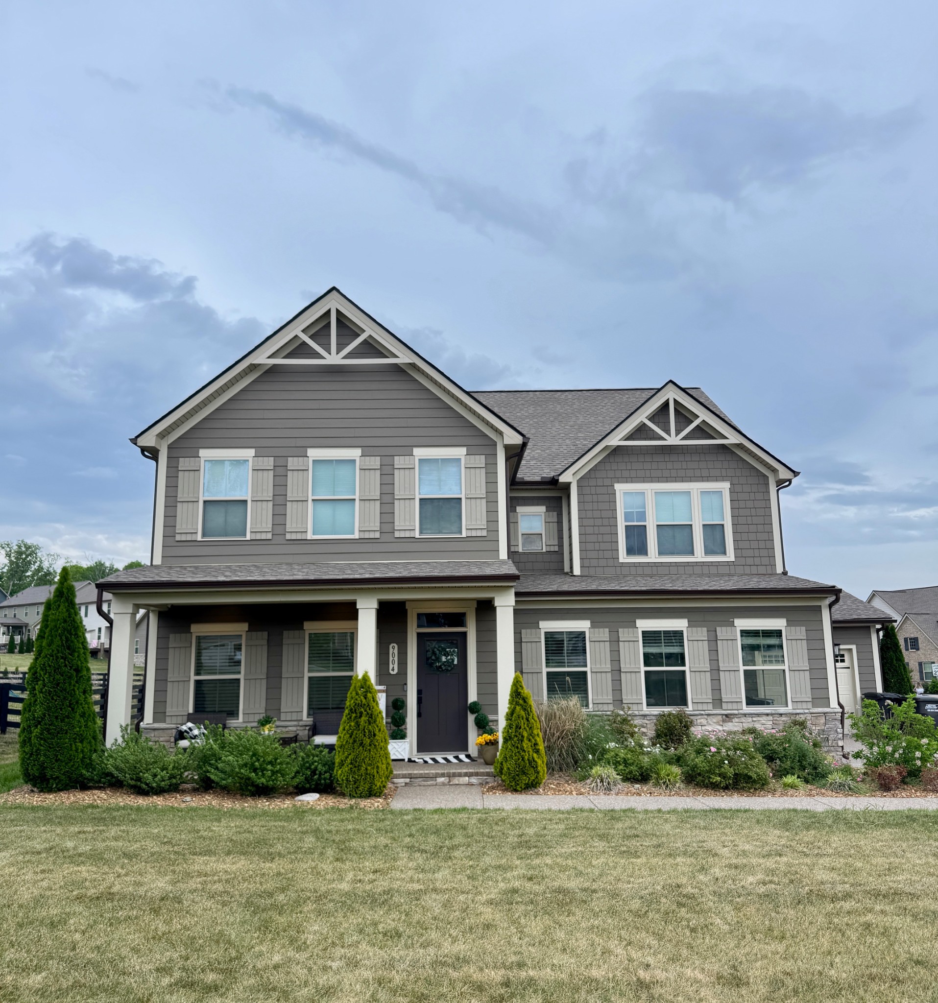 a front view of a house with a yard