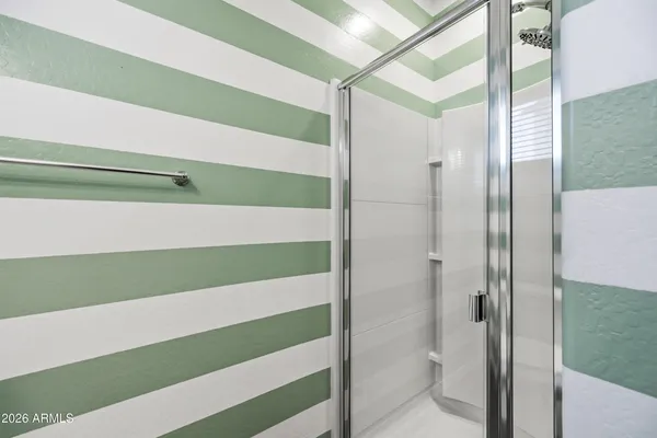 a bathroom with a shower and a toilet