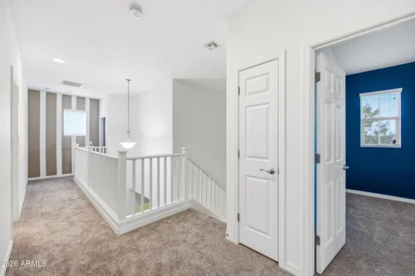 a view of a hallway with closet area
